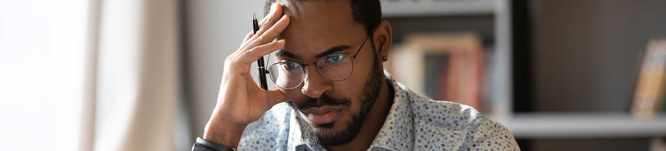 African American man studying report