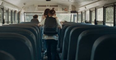 School children walking out bus