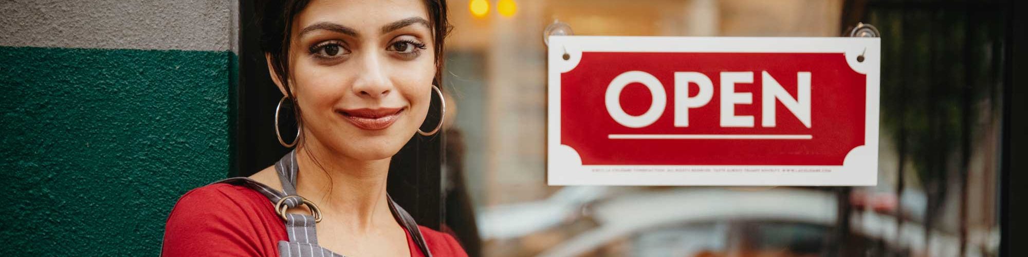 Woman standing business door