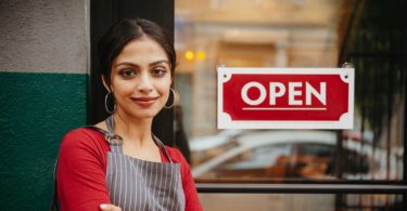 Woman standing business door