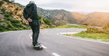 Man skating down road